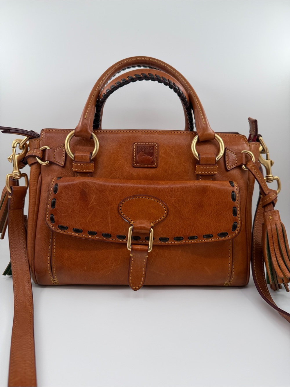 Dooney & Bourke Florentine Leather Satchel with Front Flap and Tassel cross body